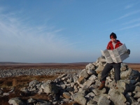 Person learning relocation techniques on a navigation course - Llangattock Moors