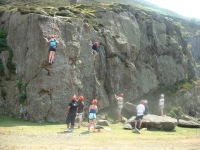 Party enjoying outdoor rock climbing